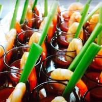 Gorgeous mini me Bloody Mary shots with a large fresh meaty prawn caught freshly this morning .